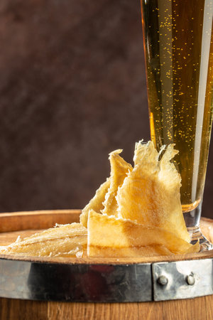 dried fish snack on a dark background. place for text, top view.の写真素材