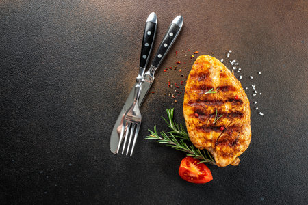 Grilled chicken breast with tomatoes and herbs, Healthy, clean eating. place for text, top view,の写真素材
