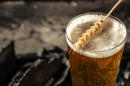 beer, wheat ears on a wooden board. banner, menu, recipe place for text.の写真素材