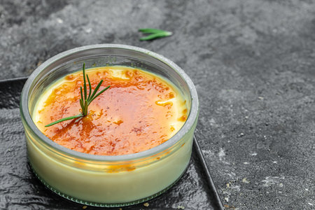 delicious cream brulee or brule, traditional french vanilla cream dessert with caramelised sugar, place for text, top view.の写真素材
