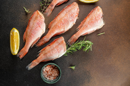 raw fish perch on a dark background. banner, menu, recipe place for text, top view,