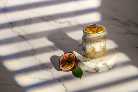 Yogurt with passion fruit in a glass. Vegan or gluten free diet. banner, menu, recipe place for text, top view.の写真素材