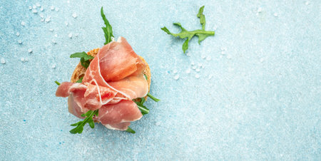 Toast with jamon serrano ham, prosciutto crudo parma. Long banner format. top view.の写真素材