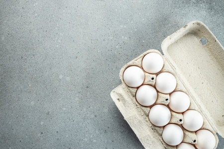 raw chicken eggs in egg box. Concept of agriculture, bio and eco farming, bio food products. place...