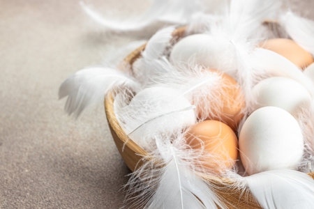 basket of chicken eggs on a dark background. top view