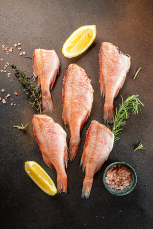 raw fish perch on a dark background. banner, menu, recipe place for text, top view,