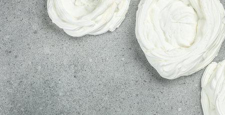 Dessert meringue cake on a light background, banner, menu, recipe place for text