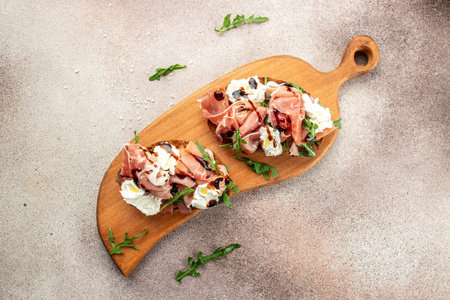 Bruschetta with prosciutto and cream cheese. Appetizers. Restaurant menu, dieting, cookbook recipe top view.の写真素材
