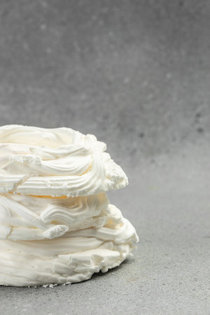 Large meringue Pavlova cake. Baking at home, vertical image. top view. place for text.の写真素材
