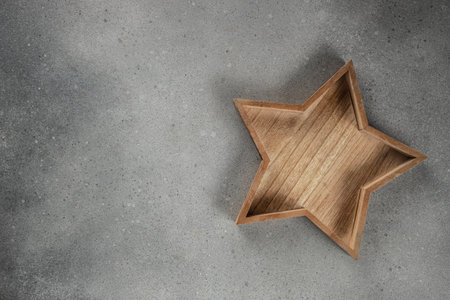 wooden box with a star for Christmas background on a light background top view. copy space.の写真素材