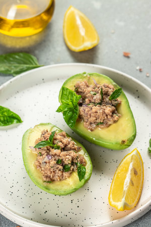 Avocado, tuna salad on plate. organic products healthy. vertical image. top view. copy space for text.の写真素材