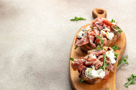 Spanish Tapas with cured Slices of jamon iberico ham. Restaurant menu, dieting, cookbook recipe top view.の写真素材