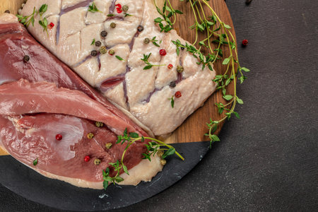 Raw duck breast fillet fresh meat on a dark background. top view. copy space for text.の写真素材
