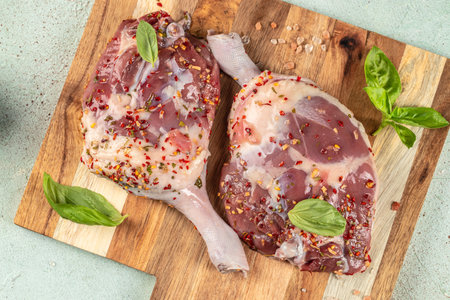 Raw meat, duck legs. Restaurant menu, dieting, cookbook recipe top view.の写真素材