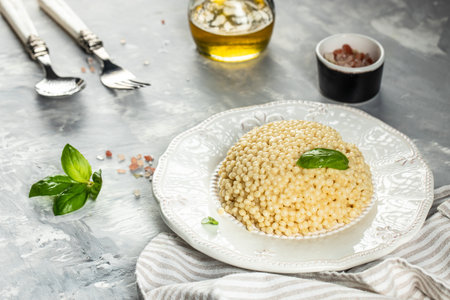 Boiled Ptitim Israeli pasta on a light background. top view. copy space for text,の写真素材