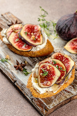 Figs fruit toast with honey and walnut. Food recipe background. Close up.の写真素材