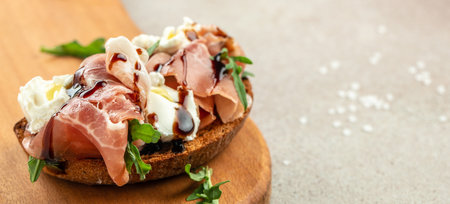 Bruschetta with prosciutto and cream cheese. Appetizers. Restaurant menu, dieting, cookbook recipe top view.の写真素材