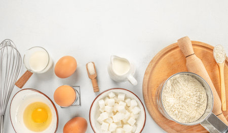 Baking or cooking background, Bakery ingredients on a white background top view. copy space,