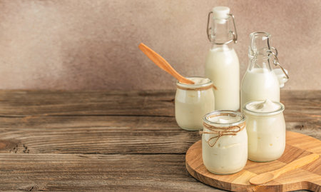 lactose-free milk and yogurt on a wooden background., Allergic food concept, Vegan diet, Long banner format,の写真素材