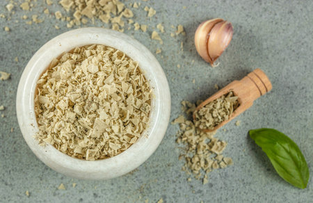 Green herbal salt of garlic and basil on a light background top view. copy space,の写真素材