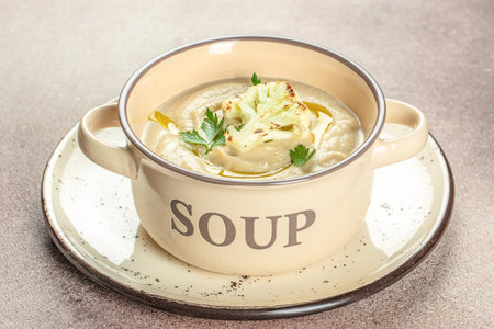 Roasted cauliflower soup on a wooden background, Restaurant menu, dieting, cookbook recipe top view,の写真素材