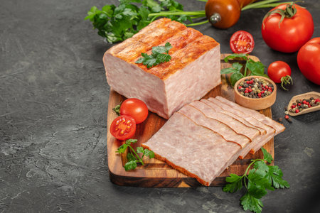 squared slice of lean pork ham on a wooden board, top view. copy space.