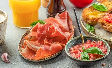 Toast with tomato and Olive oil and jamon ham, traditional Spanish breakfast.の写真素材