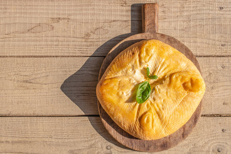 Wooden board with tasty cheese on table. banner, menu, recipe copy space, top view.の写真素材
