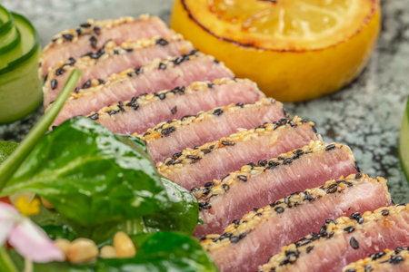 Tuna steak fried in sesame seeds. Restaurant menu, dieting, cookbook recipe top view.の写真素材