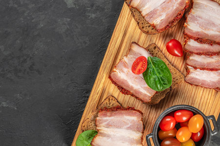 sandwich with pork ham on a wooden board, top view. copy space,の写真素材