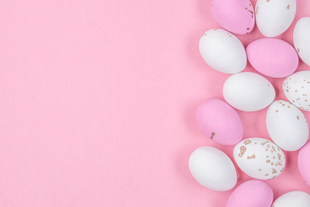 Flat lay composition of Happy Easter holiday concept. Colorful from little pastel eggs on pink background. top view, copy space.の写真素材