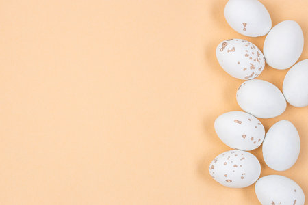 Minimalist Easter flat lay featuring elegant decorations speckled eggs. Composition in shape of...