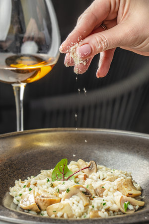 risotto with brown champignon mushrooms and white wine. dish of Italian cuisine.の写真素材