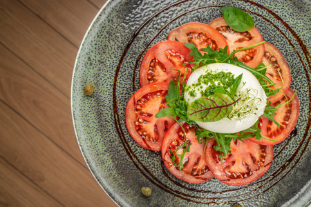 Caprese with tomato, mozzarella. Italian cuisine, healthy natural dish. Italian caprese salad. top...