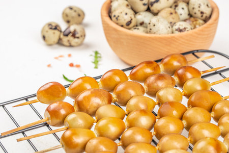 smoked eggs quail on a skewer on a white background. Healthy fats, clean eating for weight loss. top view. copy space.の写真素材