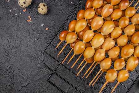smoked eggs quail on a skewer organic eggs from local farm, top view. copy space.の写真素材