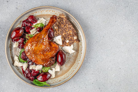 baked duck leg confit with sauce. Traditional French cuisine. top view. copy space.の写真素材
