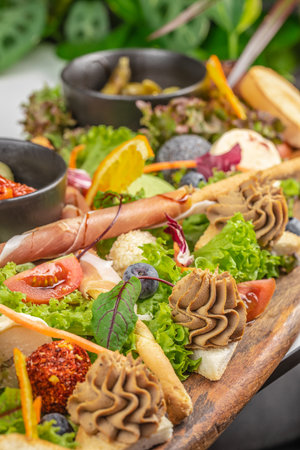 Appetizers with different antipasti, charcuterie, snacks for buffet party. antipasto board, Top view, flat lay,の写真素材