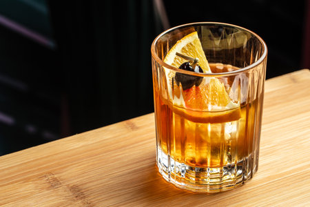Whiskey sour trendy alcoholic cocktail with bourbon, lemon juice, egg white and ice,の写真素材