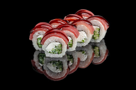 Japanese sushi rolls with tuna cucumber and cream cheese on black background.の写真素材