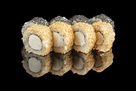 Japanese sushi rolls with sesame seeds and cream cheese on black background.の写真素材