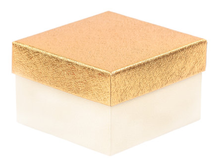Small elegant gift box with golden lid and ivory base, isolated on white background, symbolizing luxury, simplicity, and celebration in a classic minimalist style.の写真素材