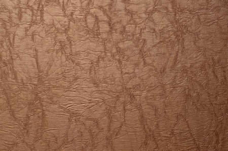 Textured background in brown tones for design or writing.の写真素材