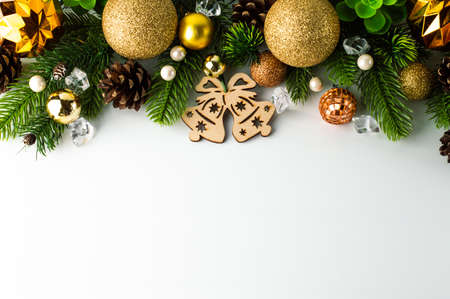 White background at the top with Christmas decor in golden brown tones. Festive background for writing text.の写真素材