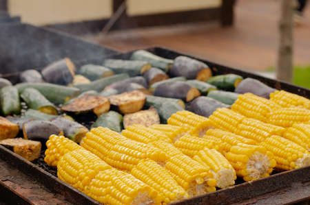 Mouth-watering corn, eggplant and zucchini are prepared on the grill. BBQ.