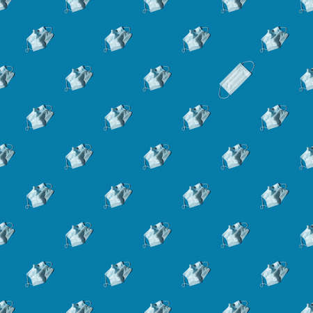 Seamless pattern of rumpled medical masks on a blue background, top view. Medicine concept.