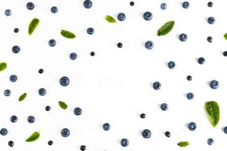 Blueberries and blueberries and mint leaves on a white background. fruit background.