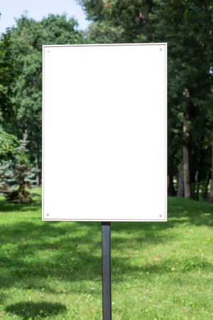 Advertising signboard with space for writing text on the background of the park on a sunny day. background for advertising.の写真素材