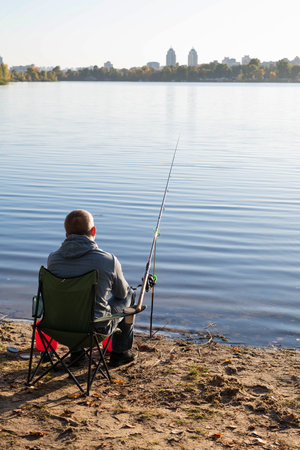 Blurred image of a man fishing on the river. The concept of outdoor recreation.の写真素材