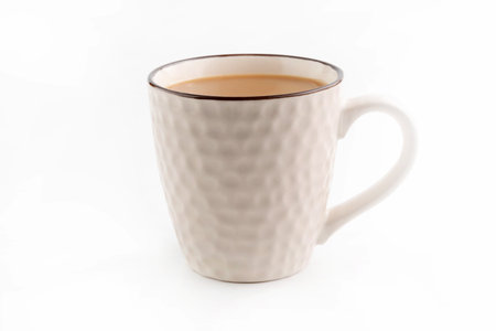 On a white background, a beige cup with cocoa.の写真素材